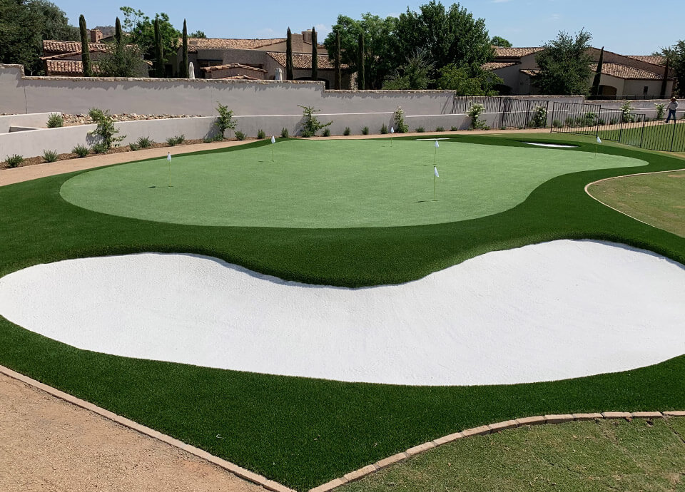 backyard putting green with artificial grass sand trap in phoenix