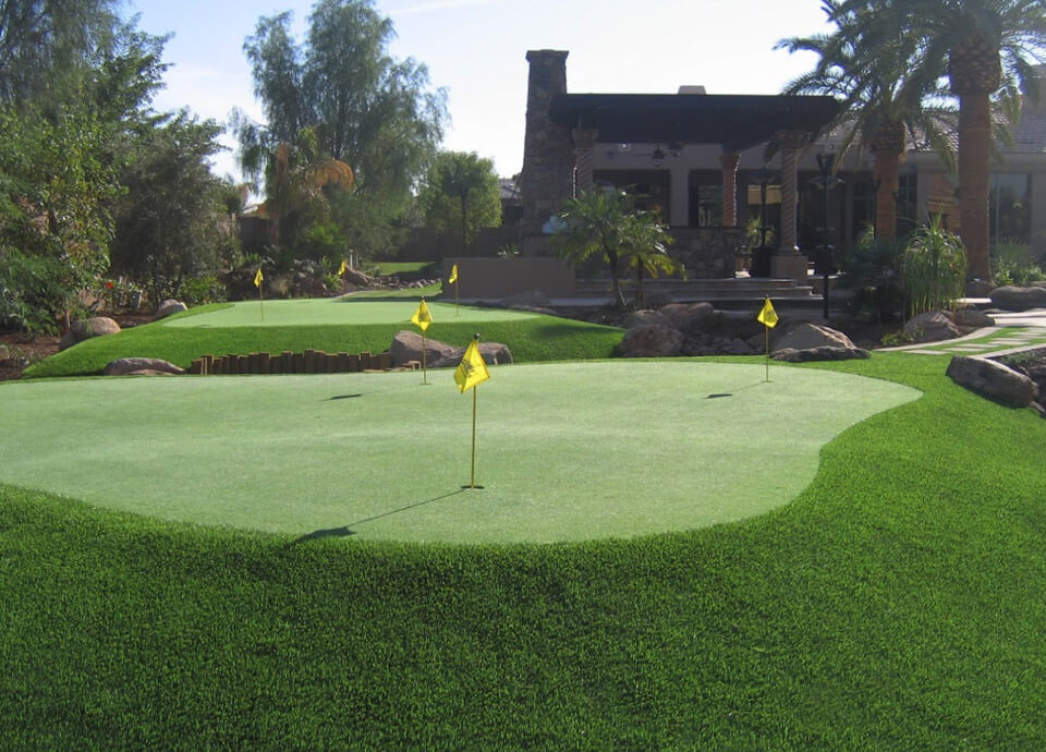 Multiple artificial grass putting greens in side yard of Phoenix home