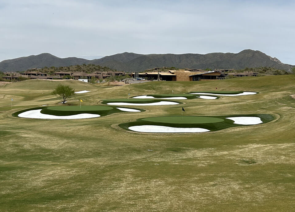 Synthetic turf putting greens on the range of Phoenix area golf club